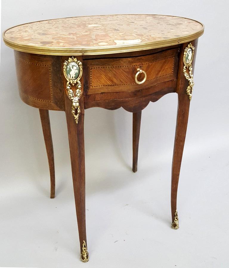 Circa 1900 French Bronze Ormolu Marquetry One Drawer: Circa 1900 French Bronze Ormolu Marquetry One Drawer Stand with pate-sur-pate Porcelain Plaques on the legs, brass band surrounding the breche d'alep marble top. Hgt 28" width 24" d 16". Good original