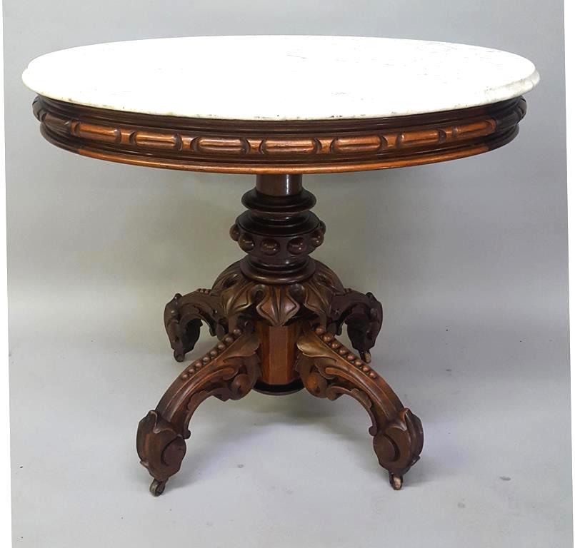 C 1870's Oval Marble Top Table by Thomas Brooks - has: C 1870's Oval Marble Top Table by Thomas Brooks - has original marble, original finish with massive center post & umbrella carved décor. Thomas Brooks, Brooklyn NY. Hgt 30" width 35" depth 25.5" Foun