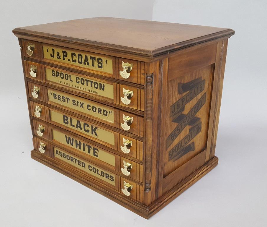 Circa 1870 JP Coats 6 drawer Spool Cabinet. Has: Circa 1870 JP Coats 6 drawer Spool Cabinet. Has original handles & original advertising on sides & the spool on the back.