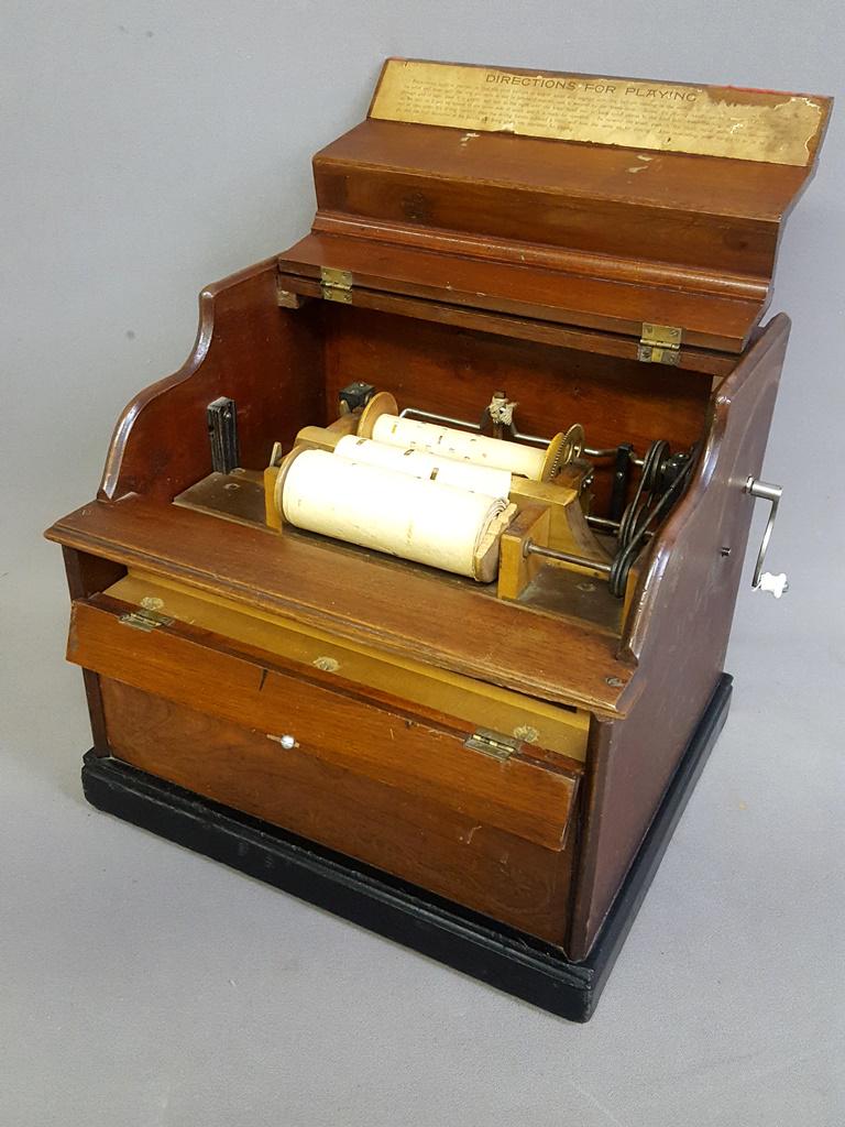 Circa 1875 (The Improved Celestina) Roller Organ. Has: Circa 1875 (The Improved Celestina) Roller Organ. Has original finish with all original Gold Stenciling on the walnut case. W 16" d 13.5" h 14". Good playing condition. On the bottom mark. Vernon J Ki