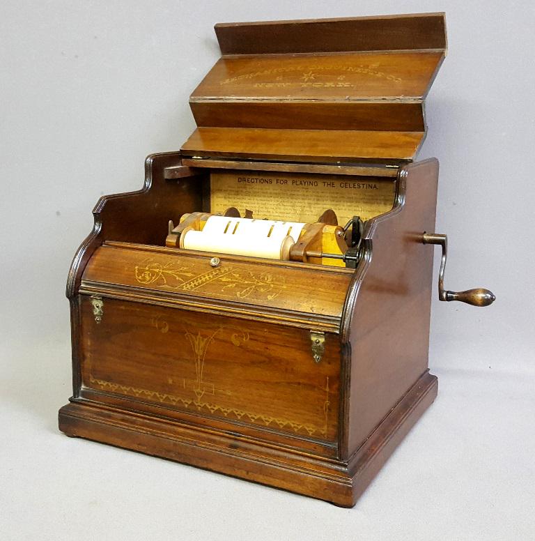 Circa 1875 Celestina Mechanical Orguinette Co. New York: Circa 1875 Celestina Mechanical Orguinette Co. New York - Roller Organ - Original finish & Gold Stenciling. Good playing condition. W 16" d 14" h 14". Found in Elgin MN home.