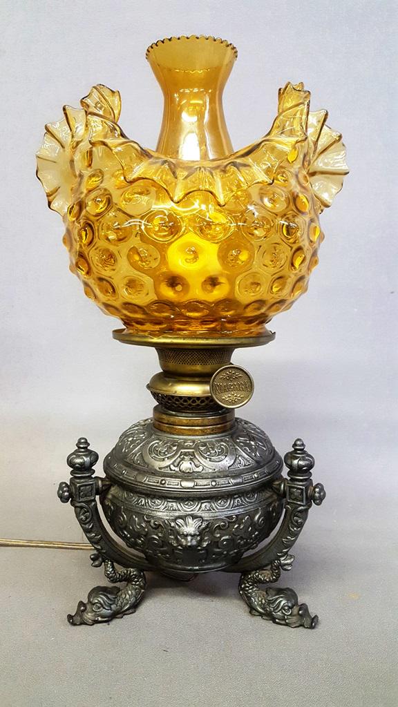 C 1880's Cast Oil Lamp Signed Niagara w/Amber Roller: C 1880's Cast Oil Lamp Signed Niagara w/Amber Roller Coaster Shade - hgt 17" dia. Of shade 9.5" Wired ready for use with electric. All glass in good condition. Found in St Paul MN home.