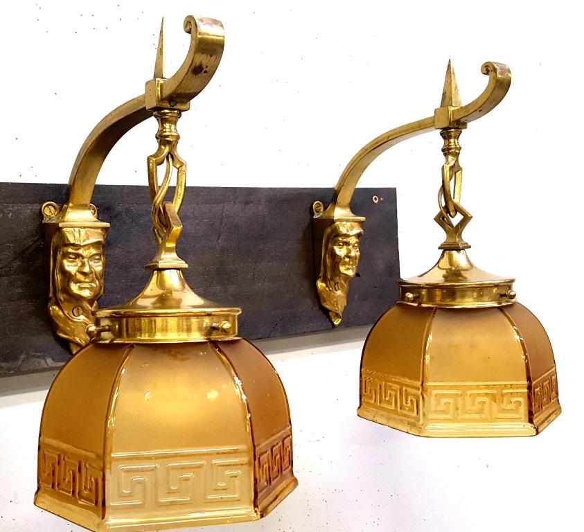 C 1920's Polished Brass Face Sconces with Quality Glass: C 1920's Polished Brass Face Sconces with Quality Glass - sconces and shades are all antique in good rewired condition. Hgt 12", depth 10". No chips or cracks.