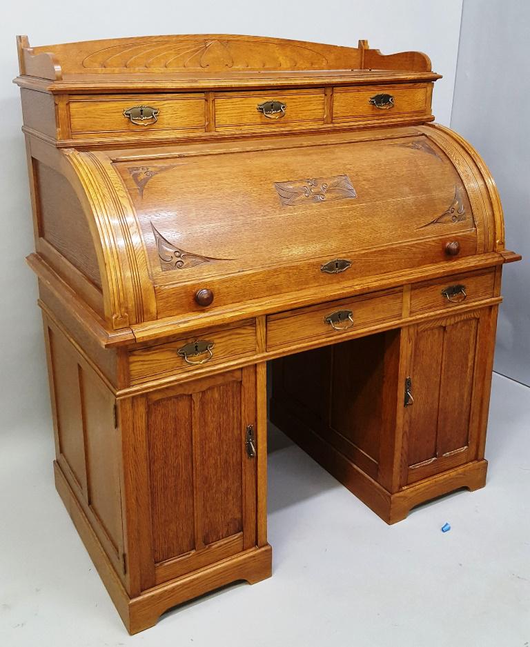 Circa 1910 Solid Carved Oak Cylinder Knee Hole Desk: Circa 1910 Solid Carved Oak Cylinder Knee Hole Desk Has great design with high quality constuction &original hardware.1/2 cut oak. Found in Minnetonka MN estate. W 50" d 28.5" h 55" Comes into 5 parts