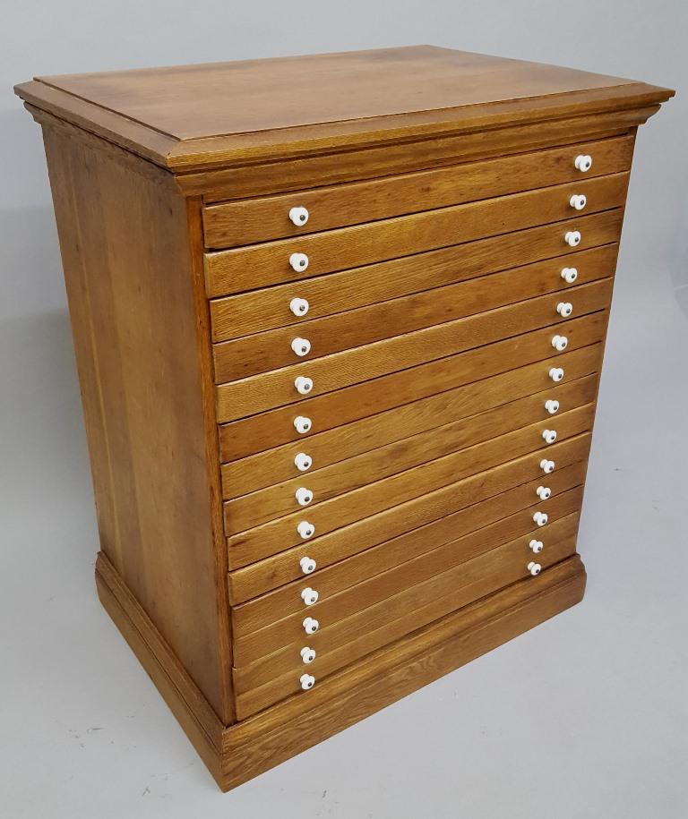 Circa 1900 Solid Oak 14 Drawer Country Store Cabinet -: Circa 1900 Solid Oak 14 Drawer Country Store Cabinet - hgt 33" width 27.5" depth 18.5". Good refinished condition. Has antique porcelain knobs. Found in Summit Ave St Paul MN home.