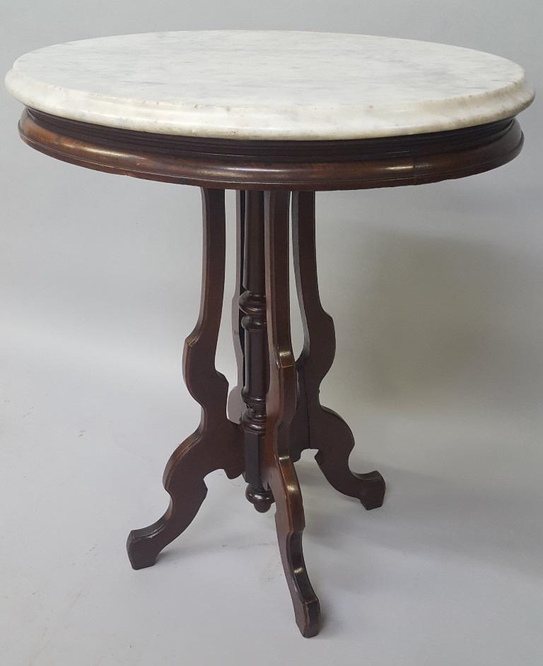 C 1870's Carved Walnut Marble Top Oval Parlor Table -: C 1870's Carved Walnut Marble Top Oval Parlor Table - very good condition with original marble & original finish. Hgt 29" w 23" d 17.5". Found in Minnetonka MN estate. I sold this table 30 years ago.