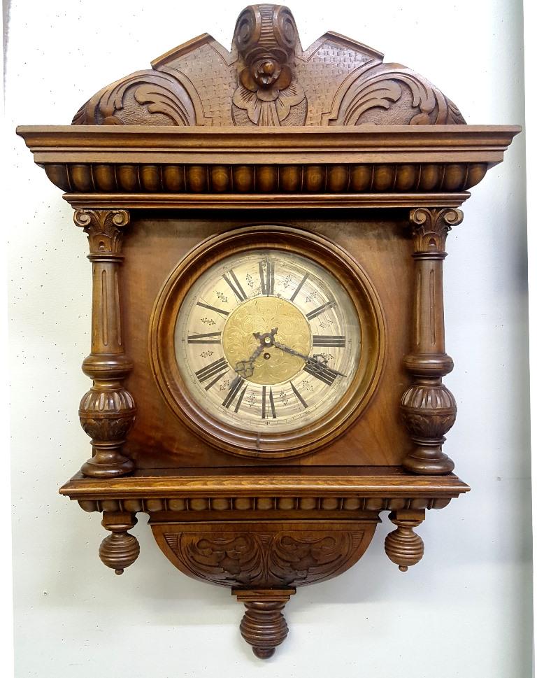 19th Century Carved Wall Clock with Brass engraved dial: 19th Century Carved Wall Clock with Brass engraved dial - hgt 33" width 22" d 9" - Found in St Paul MN home. Good condition. Has the key.