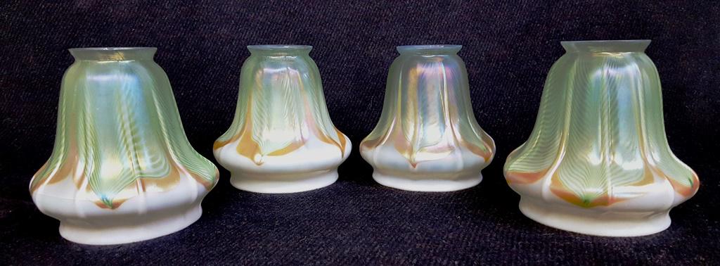 Set of 4 Green&Gold signed Steuban Pull Feather shades: Set of 4 Green&Gold signed Steuban Pull Feather shades - all 4 signed. Hgt 5" Largest dia. 5". Fitter 2.25". All in good condition. Found in St Paul MN mansion.