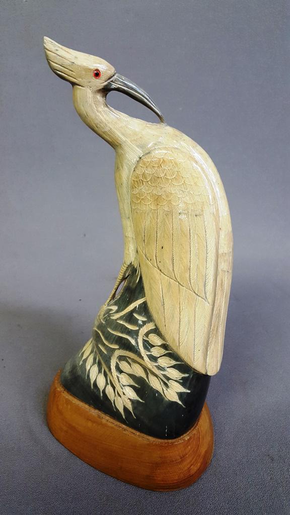 Hand Carved Bone Statue of a Bird mounted to wooden: Hand Carved Bone Statue of a Bird mounted to wooden base - hgt 11.5" w 5.5". Good condition.