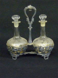 SIGNED (PAIRPOINT MFG) SILVERPLATE ENGRAVED GLASS V: SIGNED (PAIRPOINT MFG) SILVERPLATE ENGRAVED GLASS VINEGAR& OIL DECANTERS - H 11" W 10"-CIRCA 1890