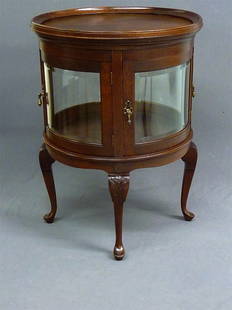 SOLID OAK BEVEL CURVED GLASS CURIO/VITRINE RAISED O: SOLID OAK BEVEL CURVED GLASS CURIO/VITRINE RAISED ON CABRIOLE LEGS - H 30" DIA. 23"- CIRCA 1900