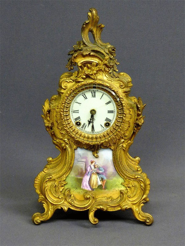 SIGNED "ANSONIA" GILT CLOCK W/HAND PAINTED ROMANTI: SIGNED "ANSONIA" GILT CLOCK W/HAND PAINTED ROMANTIC SCENE & PORCELAIN DIAL -H 15" - CIRCA 1880