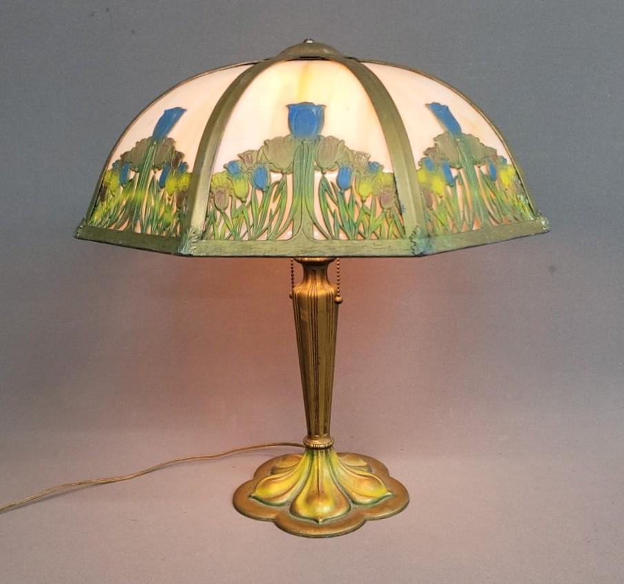 Circa 1920's Carmel Slag Glass Lamp w/painted Flower décor - has 8 carmel panels all original: Circa 1920's Carmel Slag Glass Lamp w/painted Flower dÃ©cor - has 8 caramel panels all original in good condition. Hgt 21" Dia.18" - Pictured in book on Empire lamp co. Last picture. Found in Roches