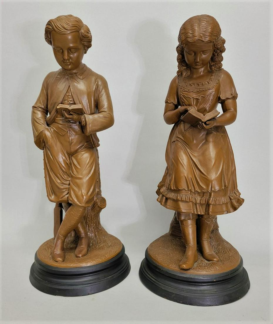 Circa 1880's Terra Cotta cast Figures of Boy & Girl Reading books. Very good original condition.: Circa 1880's Terra Cotta cast Figures of Boy & Girl Reading books. Very good original condition. Marked on the bottom. 80 - 1550. hgt 28" dia. 12". Found in Eau Claire WI estate.