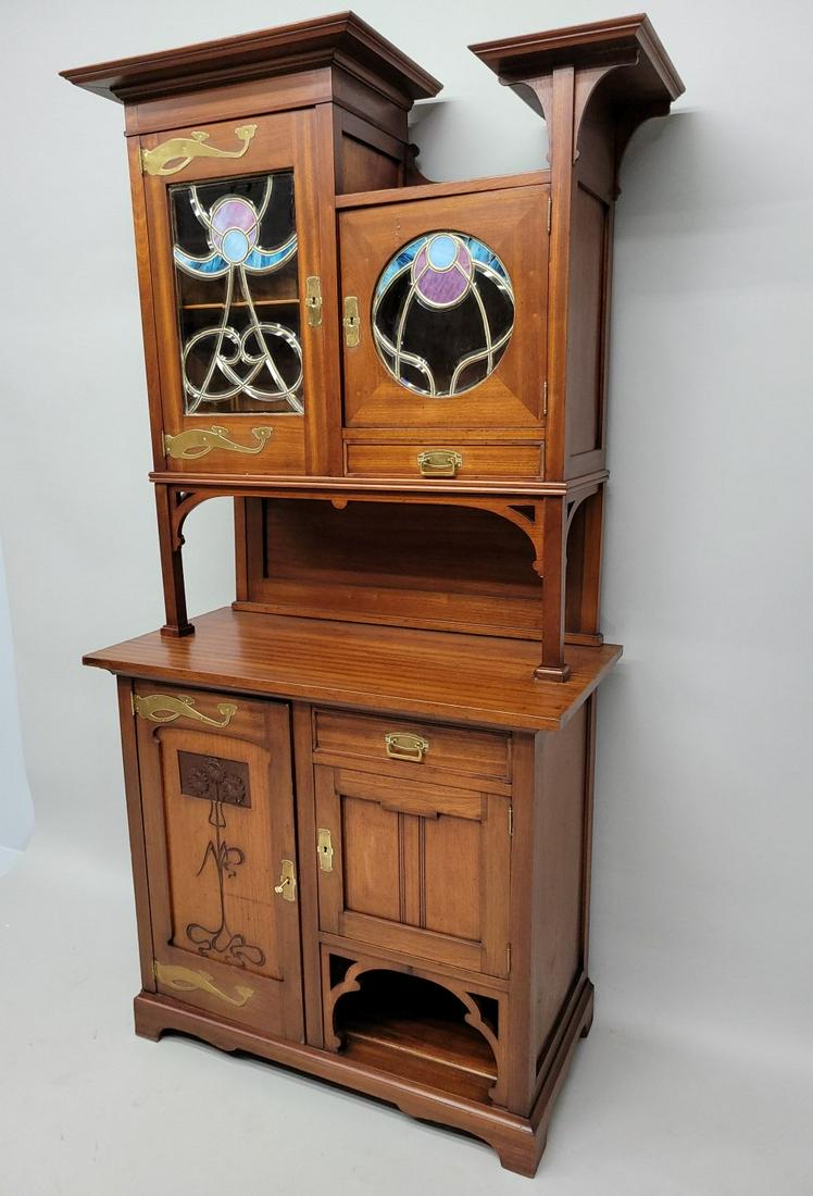 Circa 1910 Art Nouveau Leaded Glass Display Cupboard - hgt 88" w 44" d 22". Good carved mahogany: Circa 1910 Art Nouveau Leaded Glass Display Cupboard - hgt 88" w 44" d 22". Good carved mahogany with original hardware & leaded glass. Good original finish.Comes in 3 parts for easier hauling. Found 