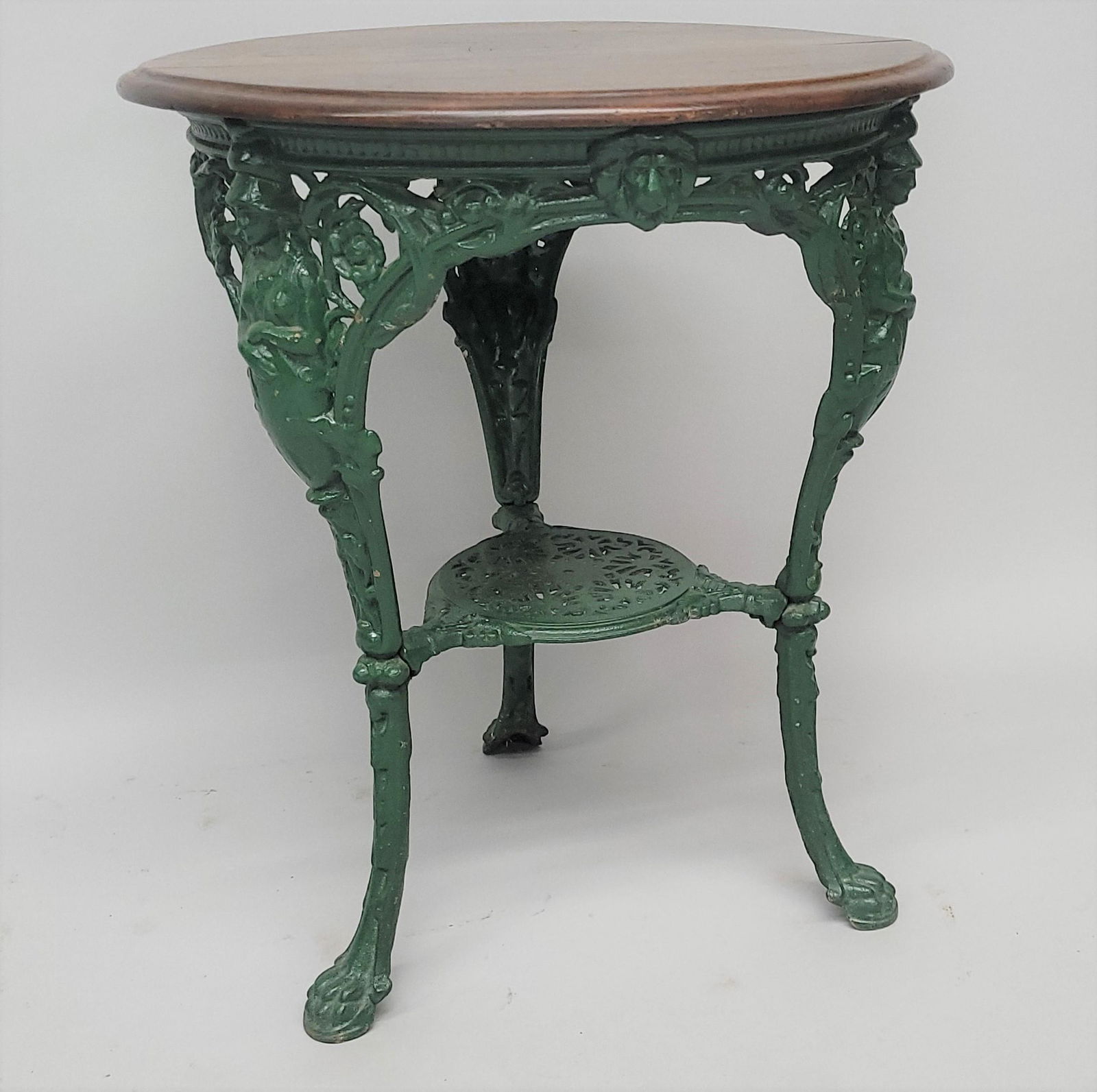 Circa 1880's Renaissance Cast Iron Table , Mahogany top with caryatid legs, h. 28 1/2 in., dia. 21 (1 of 2)
