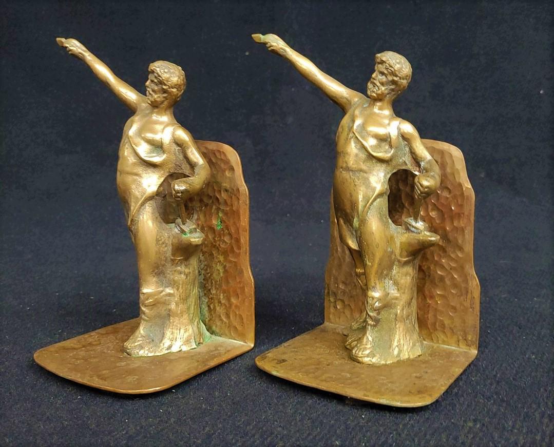 Circa 1920's Bronze figural Bookends of Man at forge holding hammer & spear end. (1 of 4)