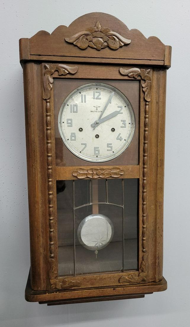 C 1915 signed (Mauthe Extra) time & stike wall clock with 8 bar chime. Key & pendulum present. Good (1 of 4)