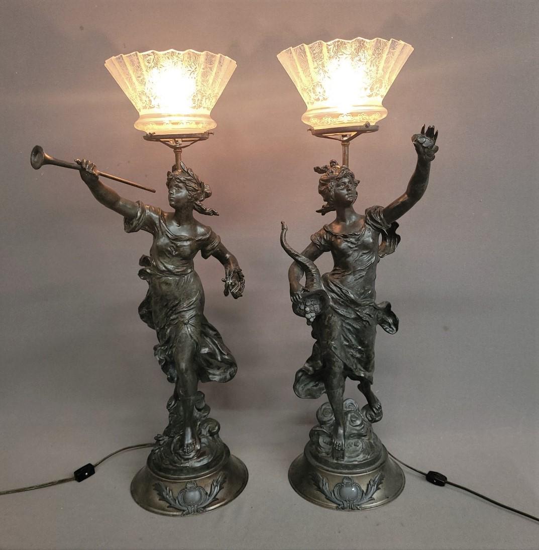 Cast Metal figural Lamps of Woman w/ Trumpet  & Woman w/cornucopia. They have  antique gas shades. (1 of 5)