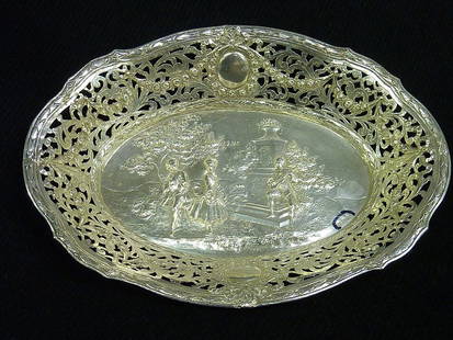 SIGNED GERMAN (.800 fine) SILVER BOWL with ORNATE S: SIGNED GERMAN (.800 fine) SILVER BOWL with ORNATE SCENE of figures in a park . Length 10 1/4" . (8 oz)