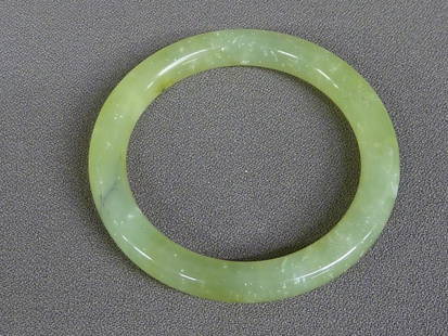 CHINESE CELADON JADE OR HARDSTONE BANGLE - DIA. 3.3: CHINESE CELADON JADE OR HARDSTONE BANGLE - DIA. 3.375" (8.57cm)