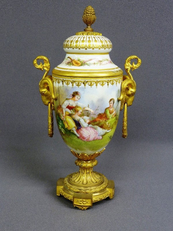 19TH CENTURY signed SEVRES FRENCH BRONZE & PORCELA: 19TH CENTURY signed SEVRES FRENCH BRONZE & PORCELAIN URN w/hand painted scene, gilt ormolu mounts, goat heads, H 18"; 1/4" chip filled on lid-rest very good