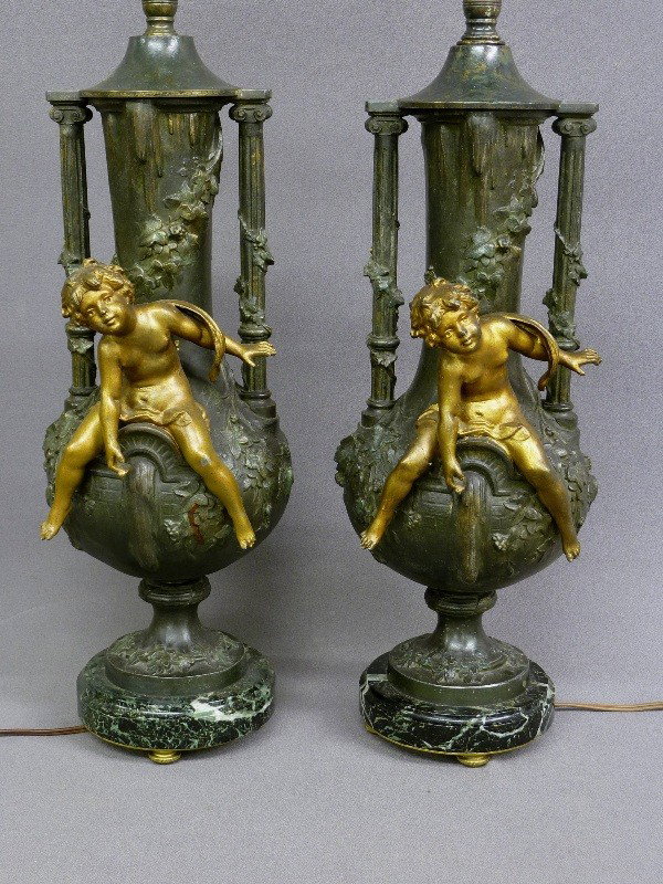 19th Century PAIR OF CAST METAL VASES with CUPIDS : 19th Century PAIR OF CAST METAL VASES with CUPIDS SITTING ON THE FRONT - signed L&F MOREAU with Reduction Seal (Paris)- Hgt without top 19 1/2" - total Hgt 38" - good patina