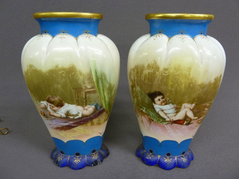Pair of Old Paris 1870's Porcelain Garniture Vases: Pair of Old Paris 1870's Porcelain Garniture Vases w/Playing Babies signed "Ahne" the backs w/sailboats - Paris Exposition awards- H 12" w 7" - some chips around the base
