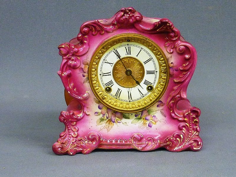 SIGNED ( SETH THOMAS) PINK & WHITE FLORAL CHINA CA: SIGNED ( SETH THOMAS) PINK & WHITE FLORAL CHINA CASE WITH ORNATE BRASS DIAL - H 10" - CIRCA 1900