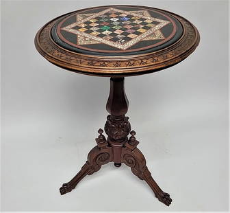 Circa 1870's Pietra Dura inlaid gaming table with carved walnut base. Good original condition: Circa 1870's Pietra Dura inlaid gaming table with carved walnut base. Good original condition hgt 29" dia. 20" . Found on the Hudson River in New York.