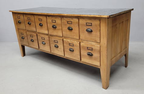 Circa 1910 Maple 12 Drawer Storage Cabinet with antique tin top.: Circa 1910 Maple 12 Drawer Storage Cabinet with antique tin top. Probably from and old general store. W 74" d 28" h 34". Good refinished condition. Found in Eau Ciare WI collection.