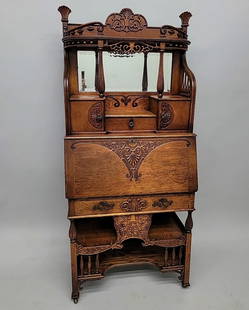 Circa 1900 1/4 Cut Oak Cowboy Dropfront Desk with elaborate decoration. Study condition with: Circa 1900 1/4 Cut Oak Cowboy Dropfront Desk with elaborate decoration. Study condition with cleaned and oversprayed finish. Hgt 69 w 30" d 14.5". Found in St Paul MN estate.