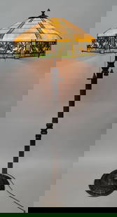 Signed Handel Circa 1920's Leaded Glass floor lamp with quality cast metal base H 66": Signed Handel Circa 1920's Leaded Glass floor lamp with quality cast metal base & signed Handel Shade. H 66" dia. Of shade 23". 1 Carmel glass has a crack. The rest is very good condition. Found in