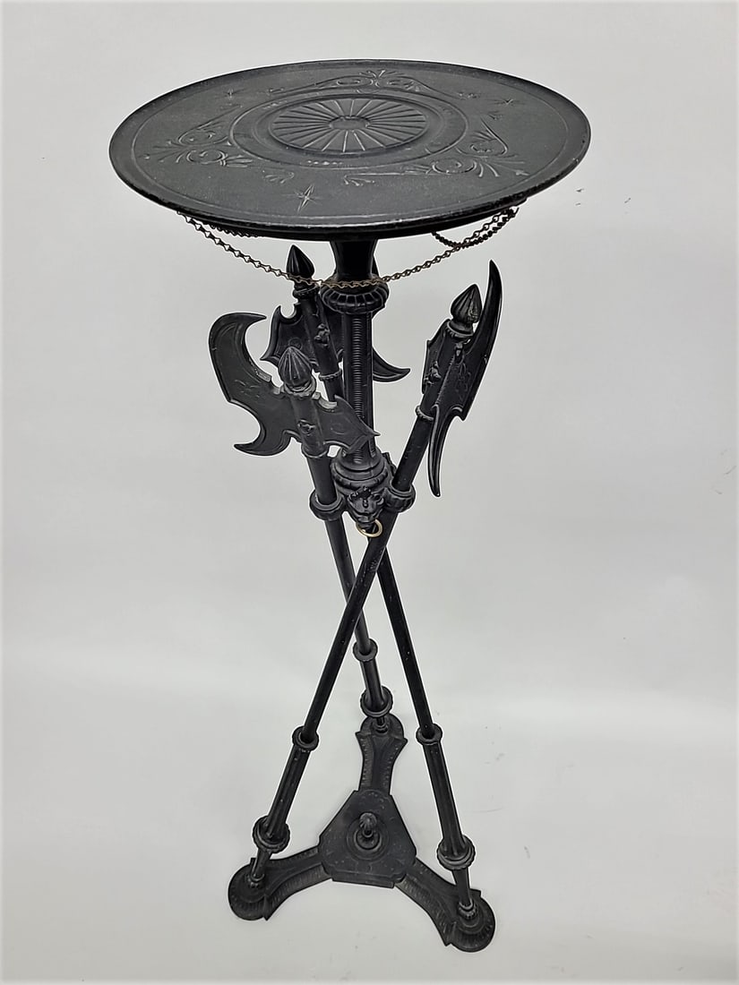 Circa 1880's Cast Iron Stand with axe & lion décor.  Hgt 44" width at base 14" dia of top 11 (1 of 5)