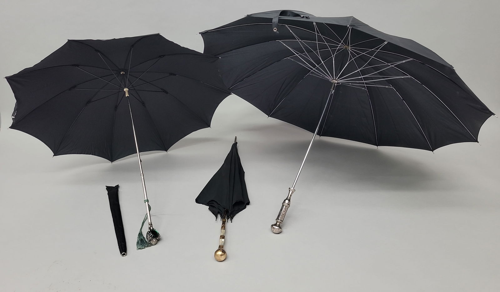 Circa 1890's Three Victorian umbrellas with ornate handles both silver and gold filled, one with a (1 of 7)