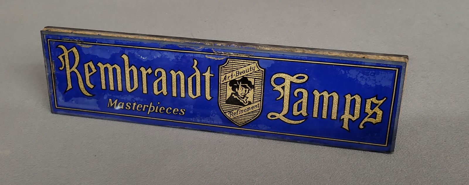 Circa 1920 Rembrant Lamp Glass Advertising Sign for display on a desk top or show case.  W 14" h (1 of 3)
