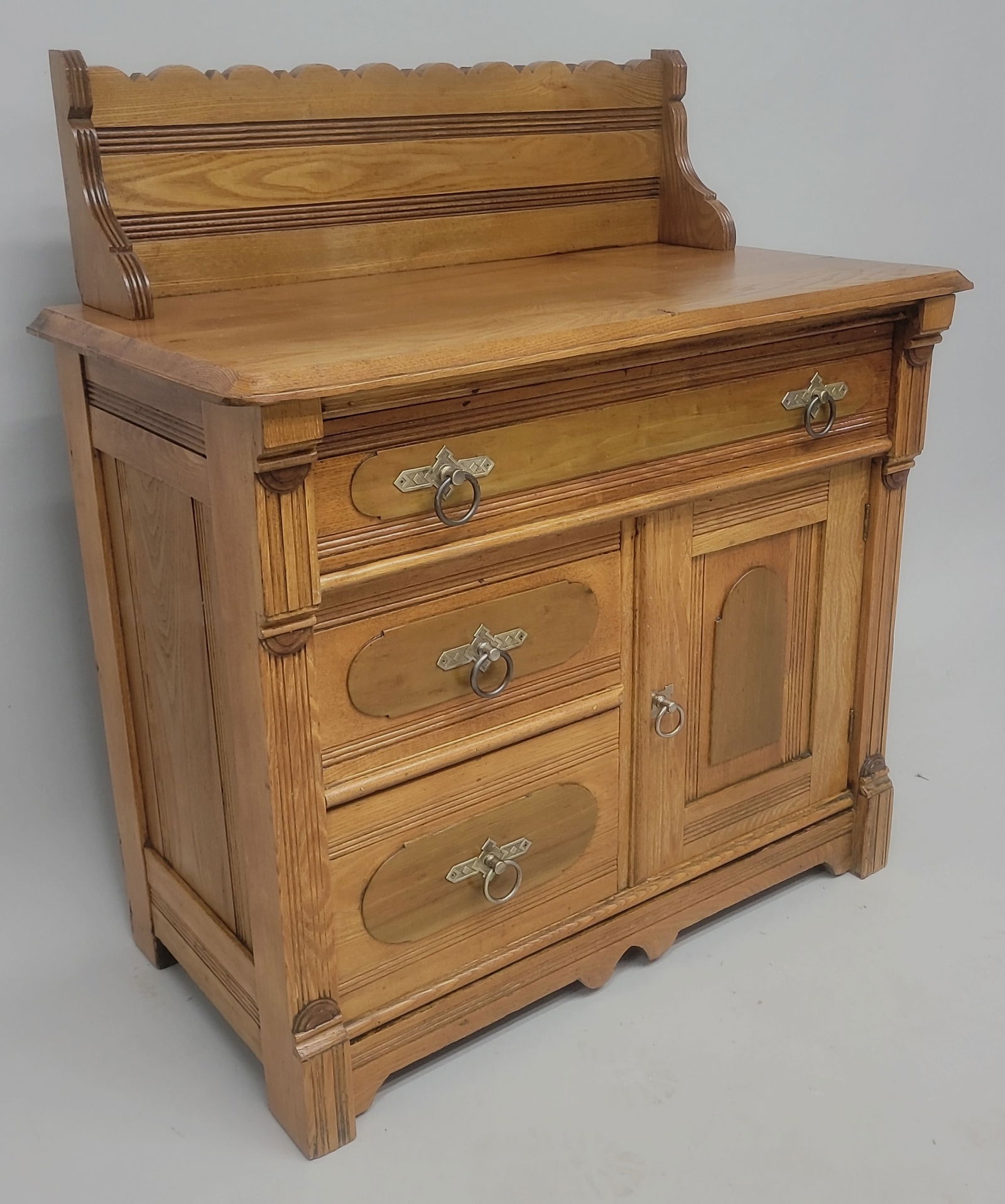 Circa 1880's Oak Eastlake Style Washstand with Antique Ring Pull Hardware and scallops back splash. (1 of 3)