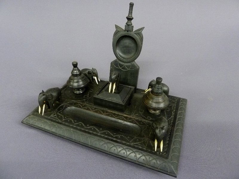 Circa 1900 ASIAN EBONY WOOD INK WELL & PEN HOLDER w: Circa 1900 ASIAN EBONY WOOD INK WELL & PEN HOLDER with ELEPHANTS with Ivory of Bone Tusks - width 10" depth 7" height 7.25" - good condition
