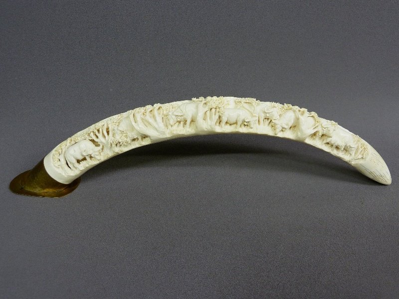 30 1/2" ELEPHANT IVORY TUSK RELIEF CARVED with WA: 30 1/2" ELEPHANT IVORY TUSK RELIEF CARVED with WATER BUFFALO, 26" measured straight. Dia. 2.5" - 1st 1/2 of 20th Century. Signed "Stuart Khoze." Marked "ZW83 10475." Good conditon