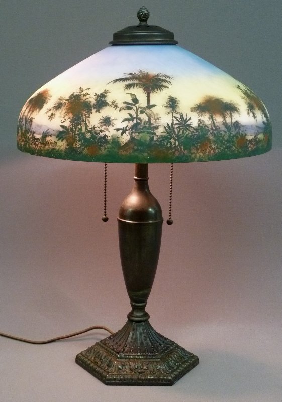 Signed "PITTSBURG 1920's" DESERT SCENE LAMP: Signed "PITTSBURG 1920's" PAINT DECORATED DESERT SCENE TABLE LAMP, pictured on the cover of lamp book - all original - shade has no chips. Height 20.5" dia. 14"
