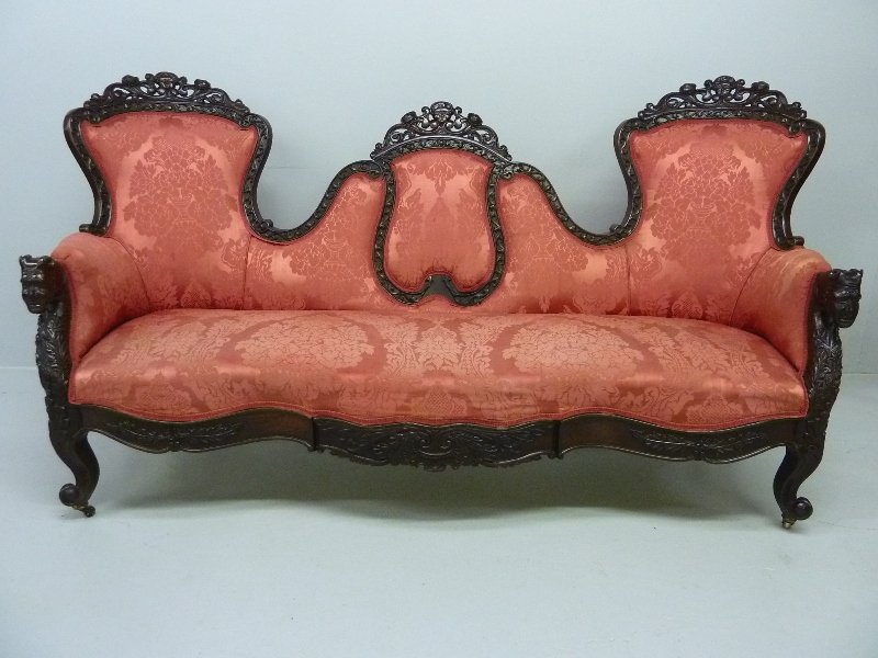 FANTASTIC 1850's ROSEWOOD AMERICAN PARLOR SOFA wit: FANTASTIC 1850's ROSEWOOD AMERICAN PARLOR SOFA with Heavily Carved Frame with Faces on Each Crest & Faces on the Arms , good original finish with damask upholstery - found in Michigan in the 1970's - 