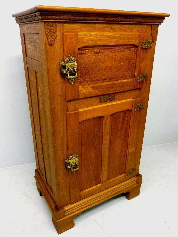Circa 1890 All Original American Oak Ice Box, Sign: Circa 1890 All Original American Oak Ice Box, Signed Alaska, Muskegon, MI, with press carved decoration and ornate original cast brass hardware, h 56" w 32" d 21.5" - from Ellsworth, WI estate