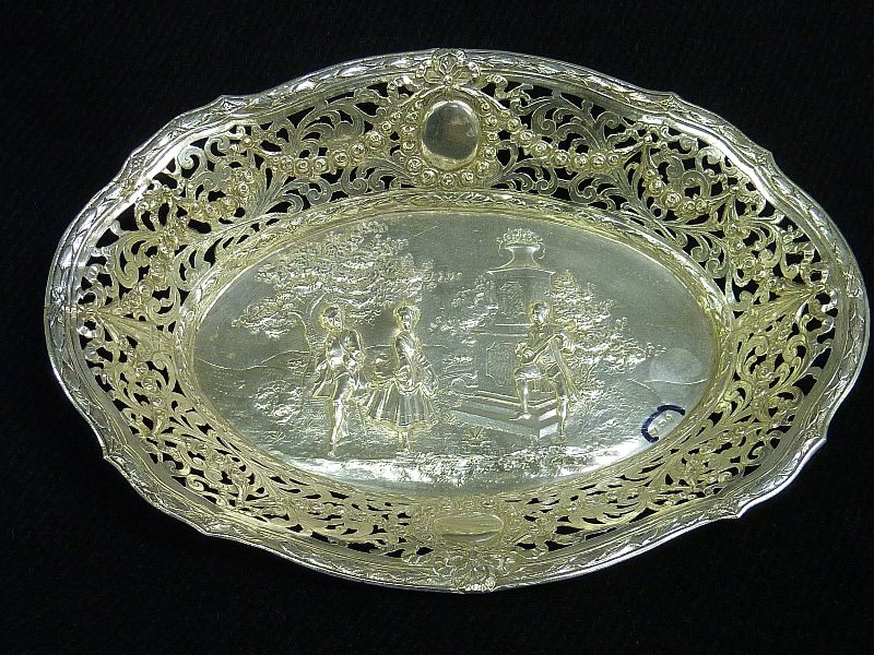 SIGNED GERMAN (marked .800 fine) SILVER BOWL with: SIGNED GERMAN (marked .800 fine) SILVER BOWL with classical scene of romantic figures in a park . Length 10 1/4" width 7 5/8" height 1 1/2" . (9 troy oz)