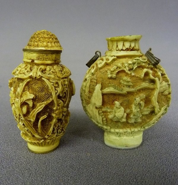 Two White Cinnabar Chinese Snuff Bottles - the one on t: Two White Cinnabar Chinese Snuff Bottles - the one on the left 2.25" x 1.25" Signed on base the one on the right 2.25" x 1.75" Signed on the bottom