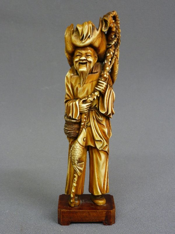 HAND CARVED 8" IVORY FIGURE OF SMILING FISHERMAN, tea s