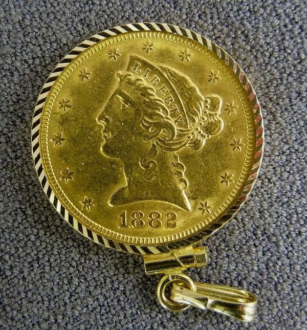 American 5 Dollar Liberty Head Gold Coin in marked 14K : American 5 Dollar Liberty Head Gold Coin in marked 14K gold clasp, minted in 1882s - grade Extremely fine - coin weight only 8.359 grams, including marked 14K gold clasp 9.66g (0.035 ozt of Gold)