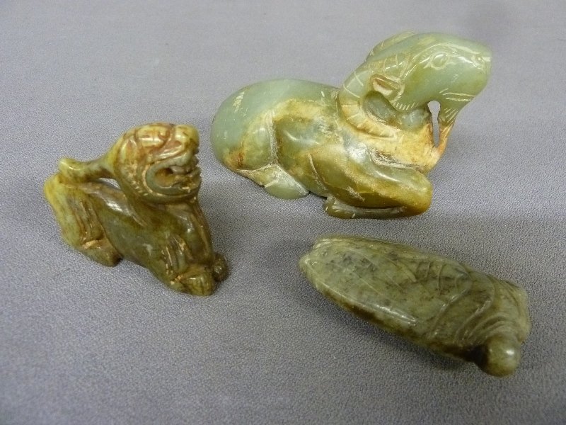 Three Carved Chinese Jade including 2 animals and a: Three Carved Chinese Jade including 2 animals and a beetle - left animal h 2.5" h 2.1" center jade animal L 4.4" h 2.8" w 1.8" right jade beetle 2.6" w 1.3" d 1" - all in good condition.