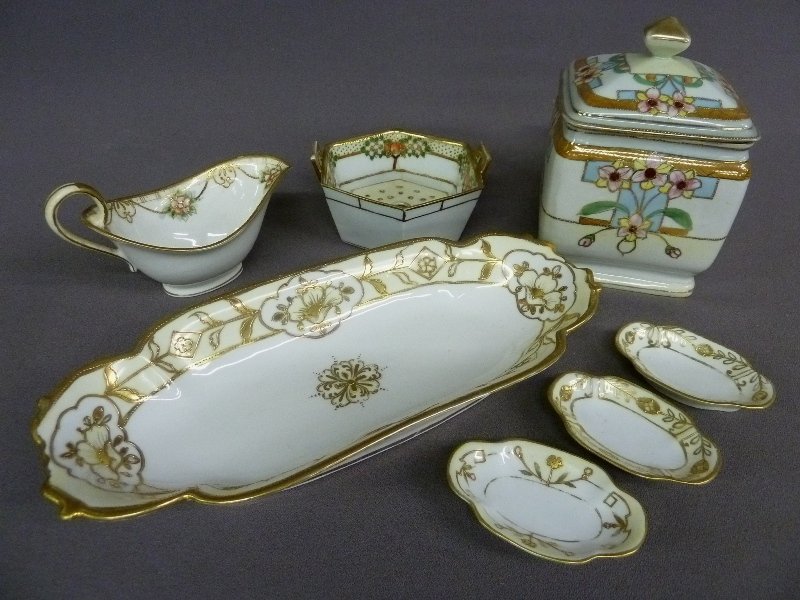 7 pieces of Signed NIPPON China including 12" x 5" Tray: 7 pieces of Signed NIPPON China including 12" x 5" Tray with 3 small trays 3.5" x 2.25" , next upper left a 6.5" x 3.5" creamer then center back a 4.75" x 2.5" hexagon w/insert last upper right Nippon