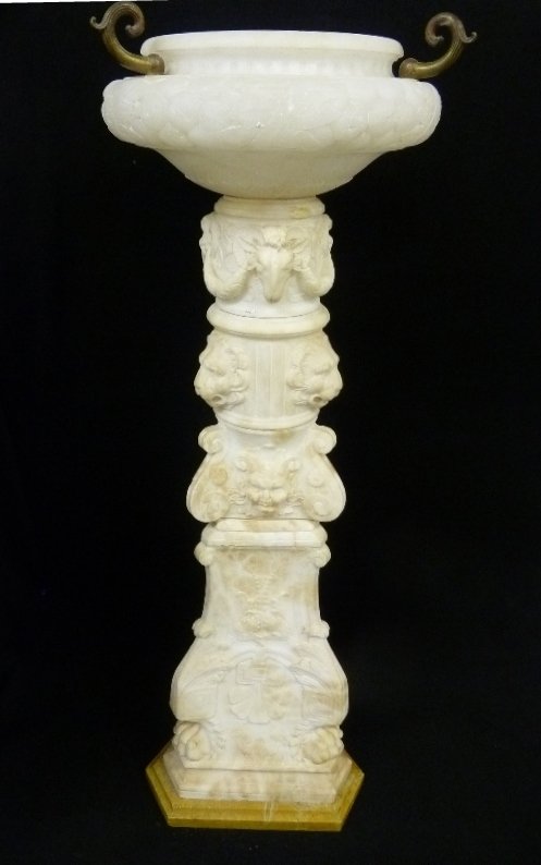 19th Century Heavily Carved Alabaster & Travertine: 19th Century Heavily Carved Alabaster & Travertine Marble Planter with Rams faces on one section, lions faces next section then carved masks ending in claw feet: height 50" dia. 17" - The base is in g