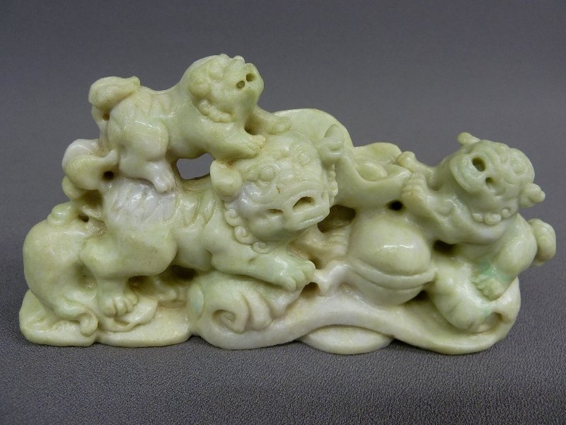 KUANG HSU CARVED PALE GREEN/WHITE MARBLE FOO DOGS: KUANG HSU CARVED PALE GREEN/WHITE MARBLE FOO DOGS PLAYING with BALL, W 7 1/2" H 4" D 1 5/8" , 20th Century, good condition